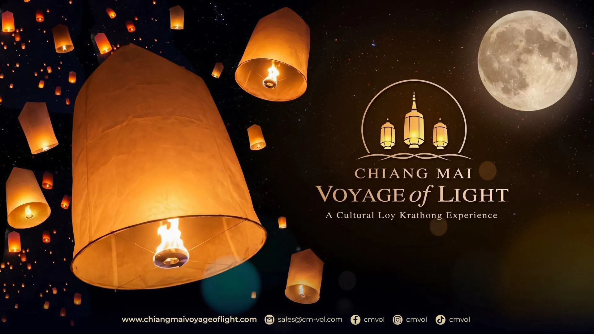 Lanterns floating in the night sky during Chiang Mai Voyage of Light festival.