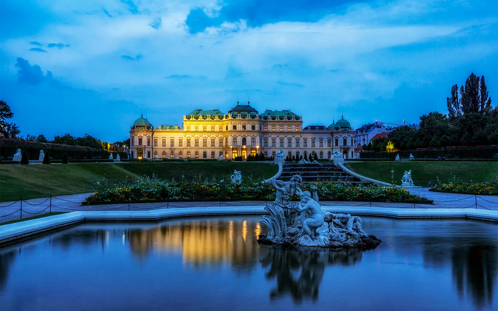 Upper Belvedere Palace reflecting in pond with garden view, Vienna, Austria.