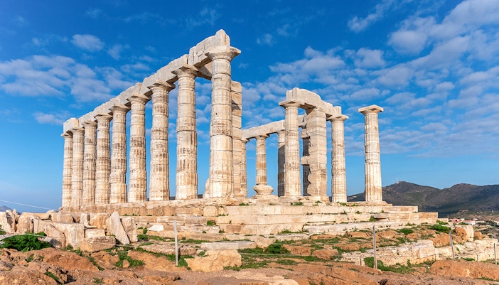 Temple of Poseidon at Sounion during sunset, Attica, Greece, highlighting ancient Greek architecture.