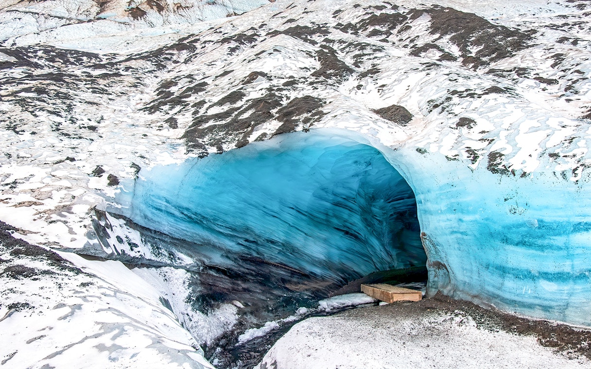 Ice cave entrance with blue ice in Kötlujökull, Vik, Iceland.