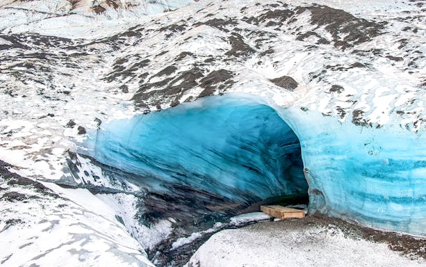 Ice cave entrance with blue ice in Kötlujökull, Vik, Iceland.