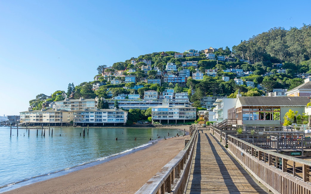 Wooden pier leading to hillside homes in Sausalito near San Francisco, CA.