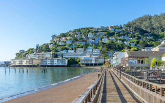 Wooden pier leading to hillside homes in Sausalito near San Francisco, CA.