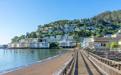 Wooden pier leading to hillside homes in Sausalito near San Francisco, CA.