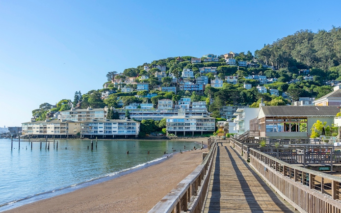 Wooden pier leading to hillside homes in Sausalito near San Francisco, CA.