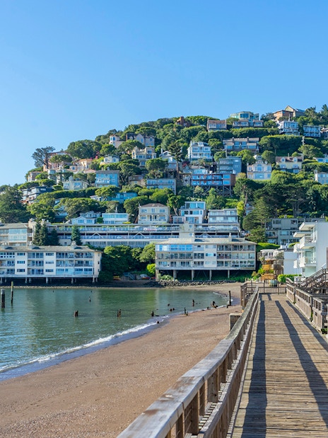 Wooden pier leading to hillside homes in Sausalito near San Francisco, CA.
