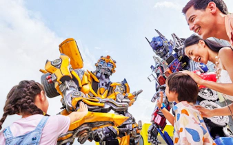 Visitors interacting with Transformers characters at Universal Studios Singapore.