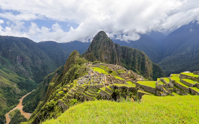 Machu Picchu ruins with Huayna Picchu mountain in the background, Peru.