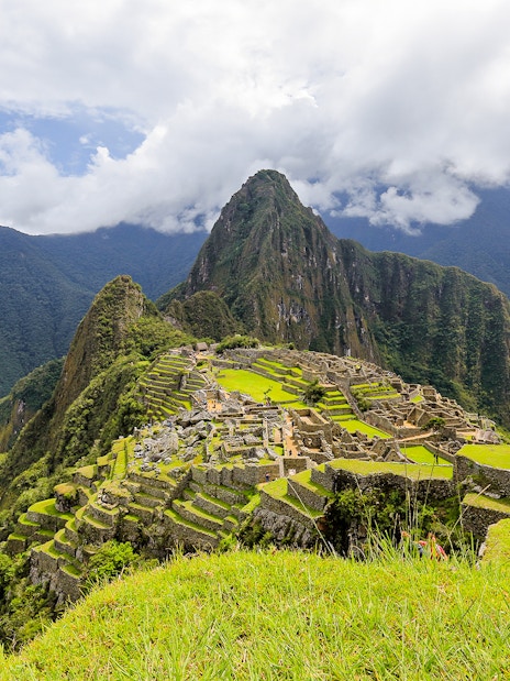 Machu Picchu ruins with Huayna Picchu mountain in the background, Peru.