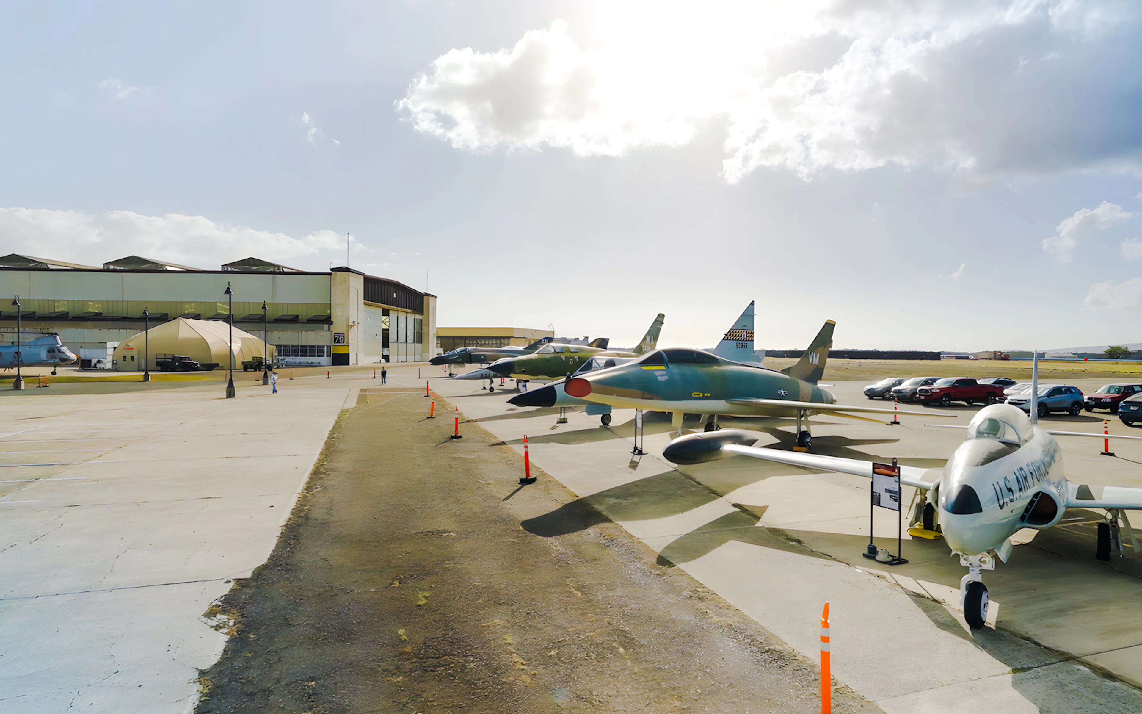 Pearl Harbor Aviation Museum exterior with vintage aircraft display.
