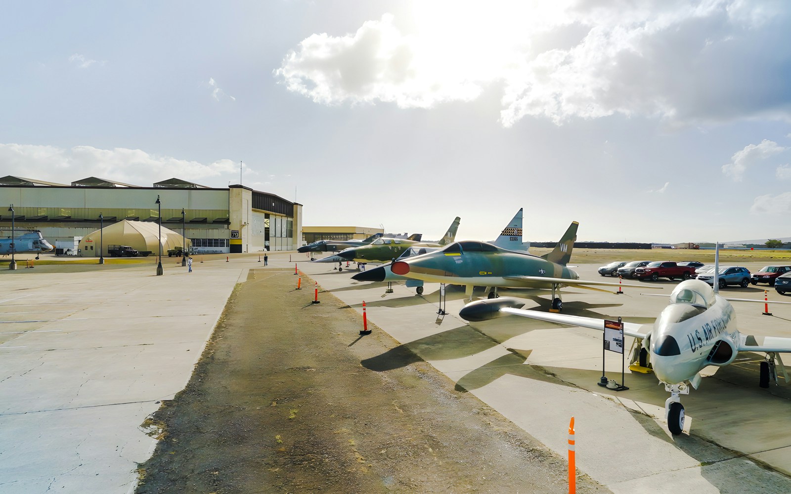 Pearl Harbor Aviation Museum exterior with vintage aircraft display.