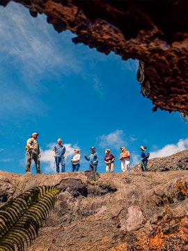Guests exploring volcanic terrain on Hawaii adventure tour.
