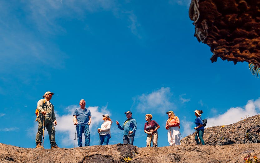 Guests exploring volcanic terrain on Hawaii adventure tour.