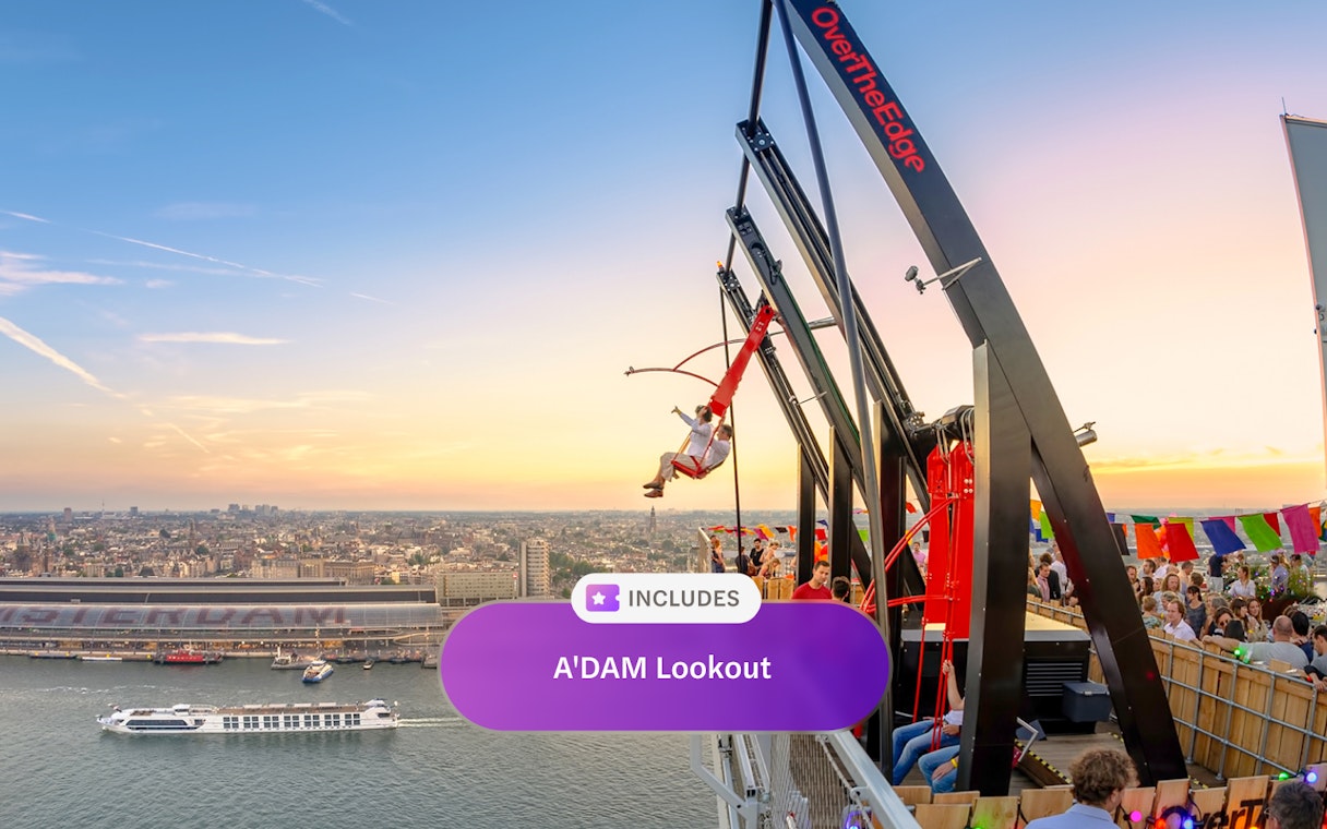ADAM Lookout swing with Amsterdam cityscape at sunset.