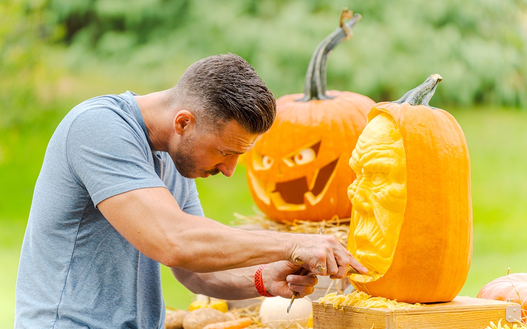Pumpkin carving demonstration at New York Botanical Garden.