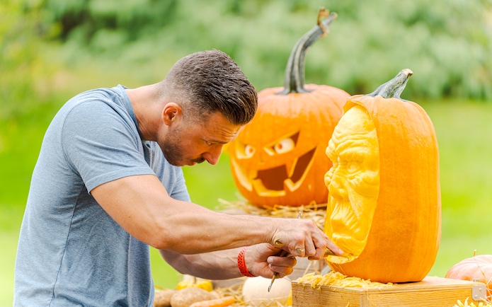 Pumpkin carving demonstration at New York Botanical Garden.