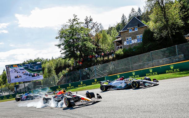 Race cars on track at Formula 1 Belgian Grand Prix, Spa-Francorchamps.