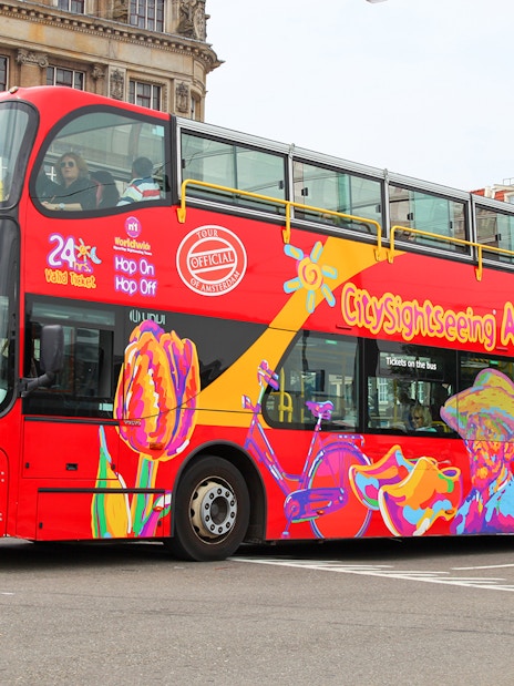 City Sightseeing hop on hop off bus in Amsterdam with colorful design.