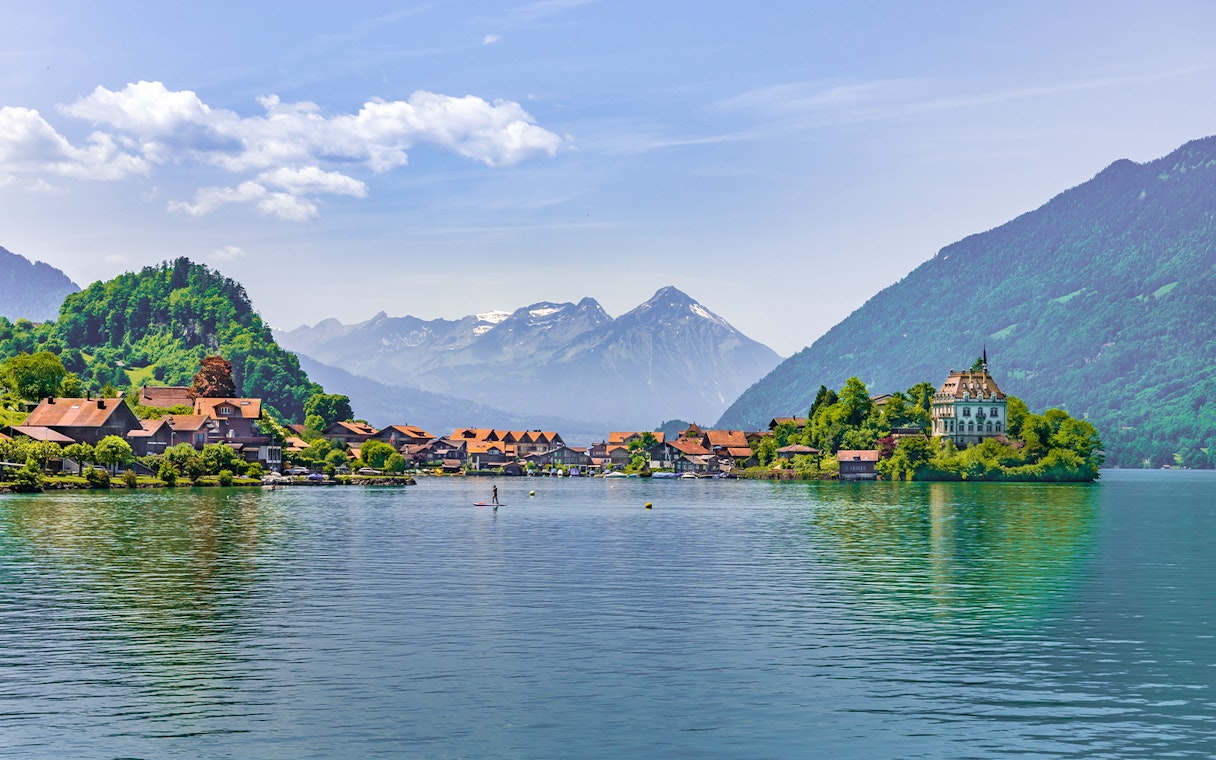 Fishing village of Iseltwald on Lake Brienz with mountains in the background, Switzerland.