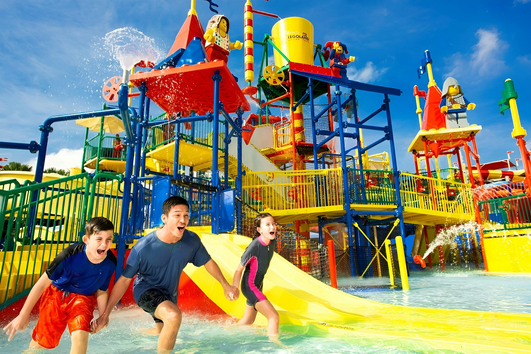 Children enjoying the Joker Soaker water play area at Legoland Water Park, Malaysia.