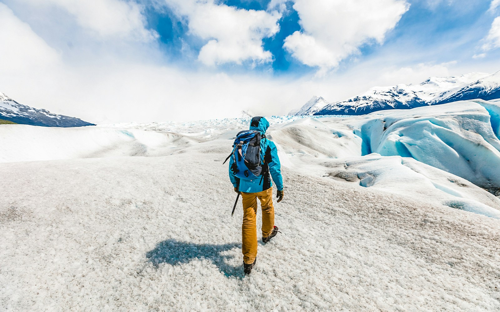 Visitor hiking with guide on Perito Moreno Glacier, Patagonia, Argentina.