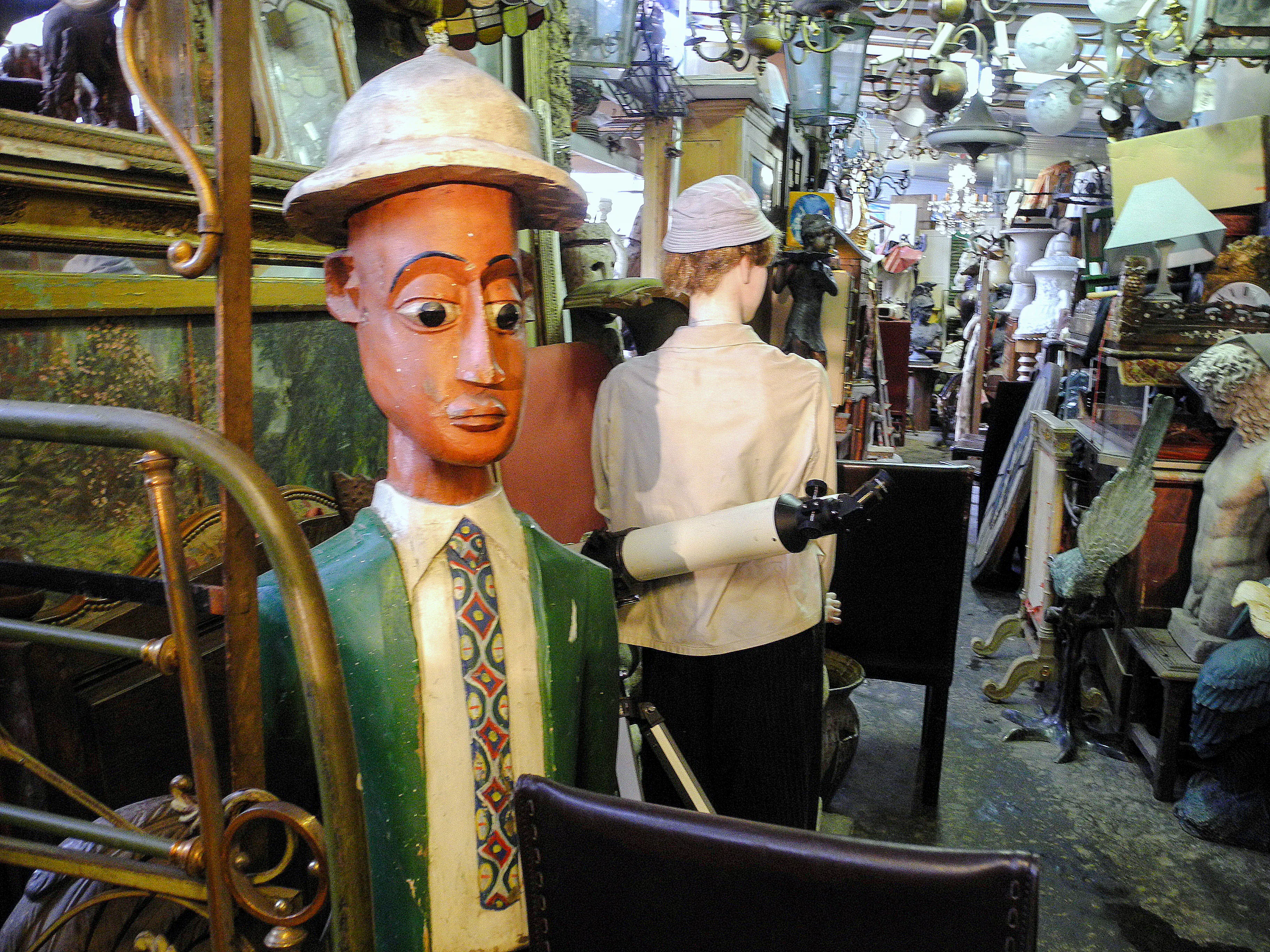 Antique shop with eclectic items at Marché aux Puces de Saint-Ouen, Paris.