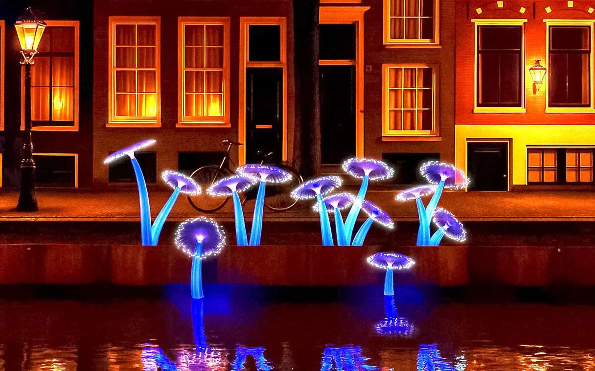 Illuminated art installation resembling mushrooms along Amsterdam canal during Light Festival cruise.