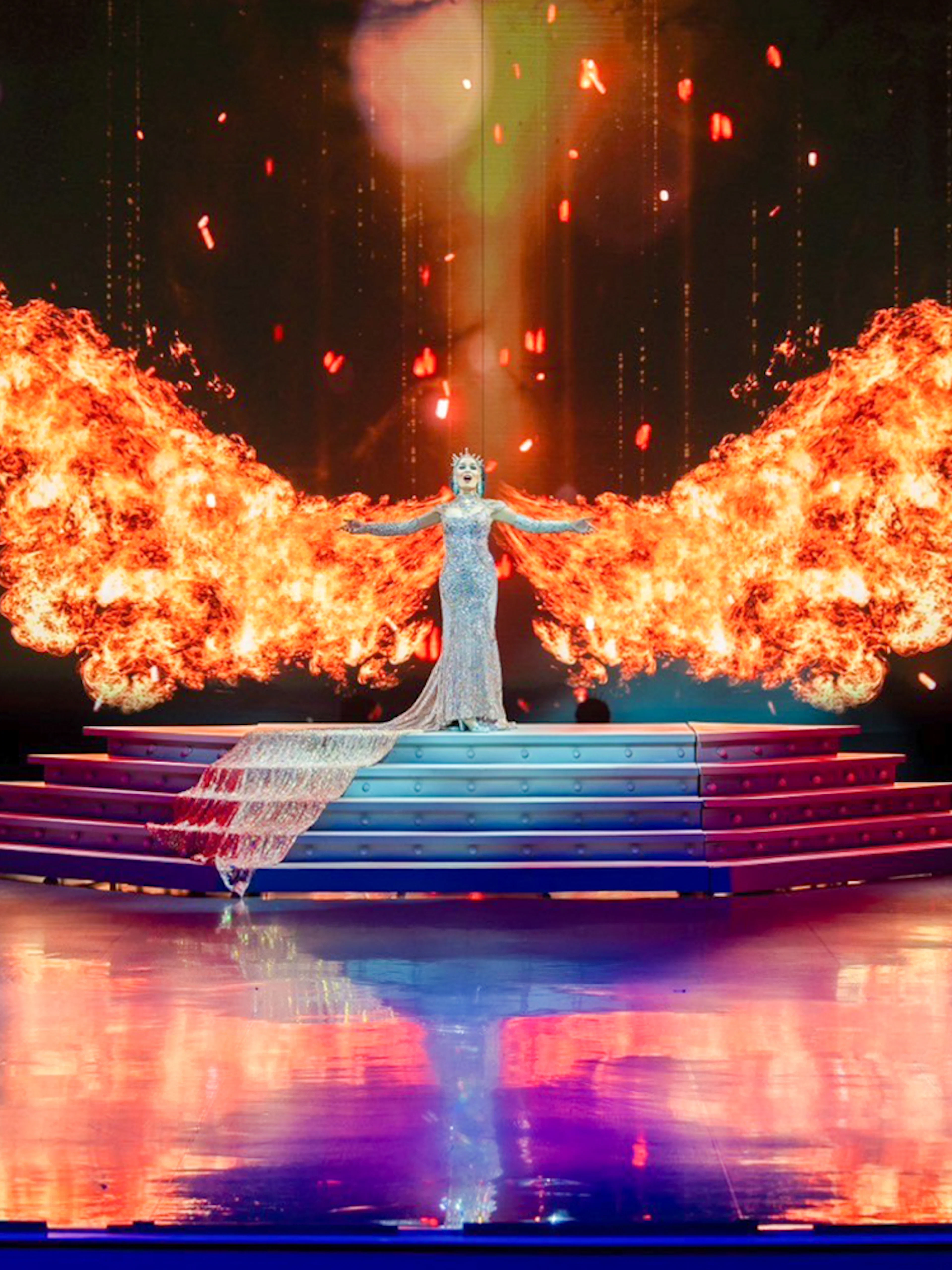 Performer with fiery wings on stage at Colosseum Cabaret Show, Pattaya.