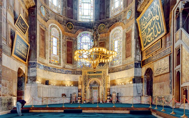 Hagia Sophia interior with ornate domes and arches, Istanbul, Turkey.