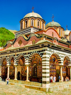 Rila Monastery in Bulgaria with colorful frescoes and domed architecture.