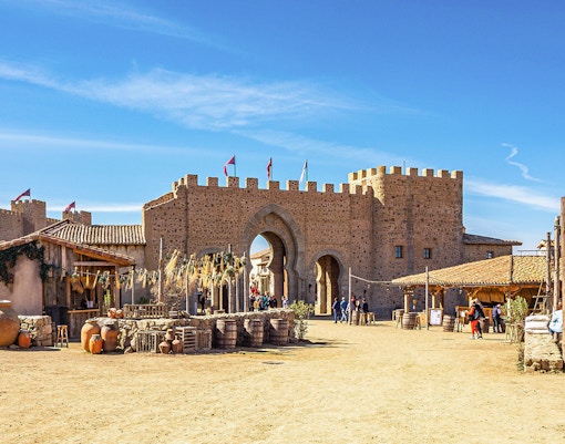 Puy du Fou España park medieval village scene with actors in period costumes.