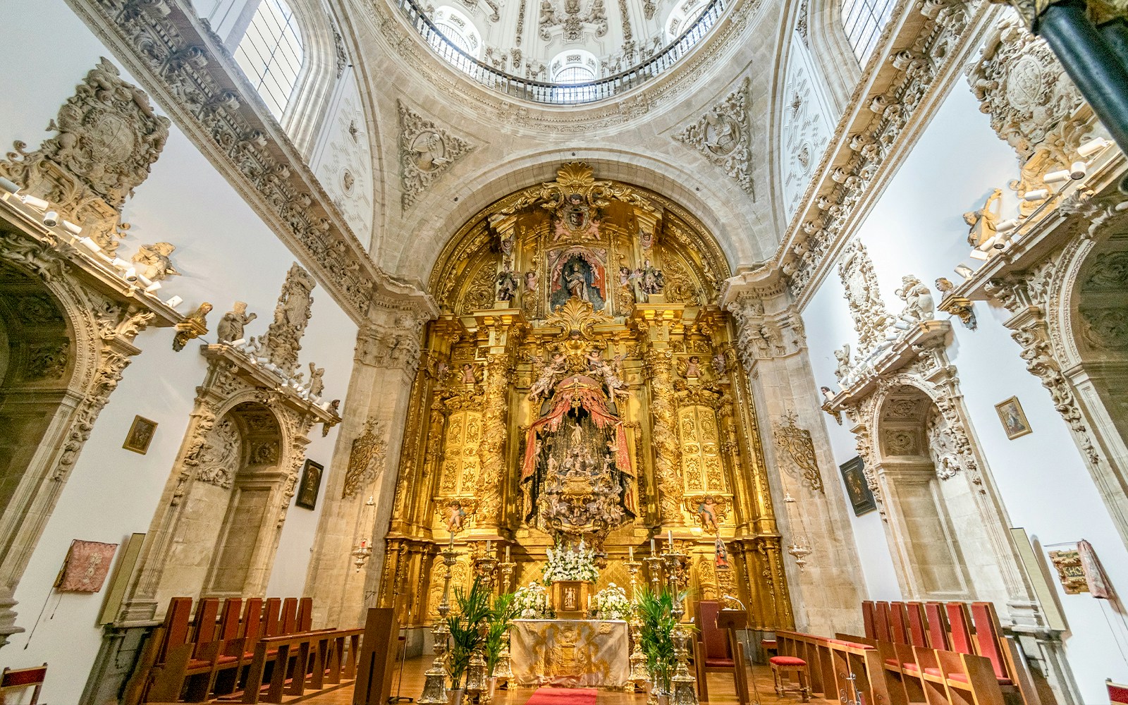 Segovia Cathedral Chapel of the Blessed Sacrament with ornate gold altar and intricate carvings.