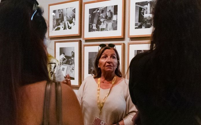 Guide discussing artwork at Picasso Museum, Barcelona.