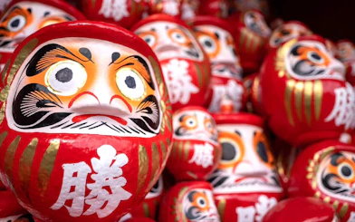 Kachi Daruma dolls on offering shelf at Katsuo-ji Temple, Japan.