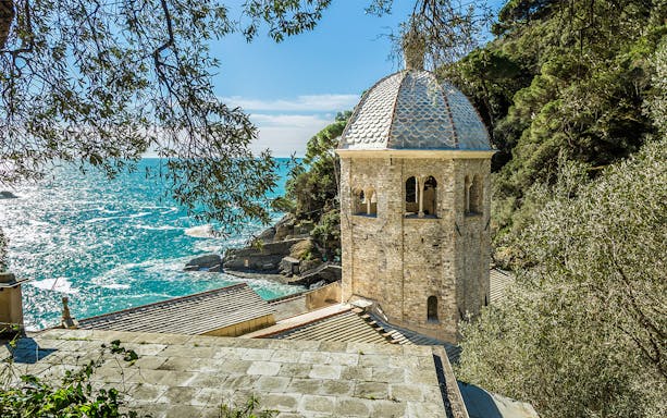 Abbazia di San Fruttuoso tower overlooking the sea in Genoa, Italy.