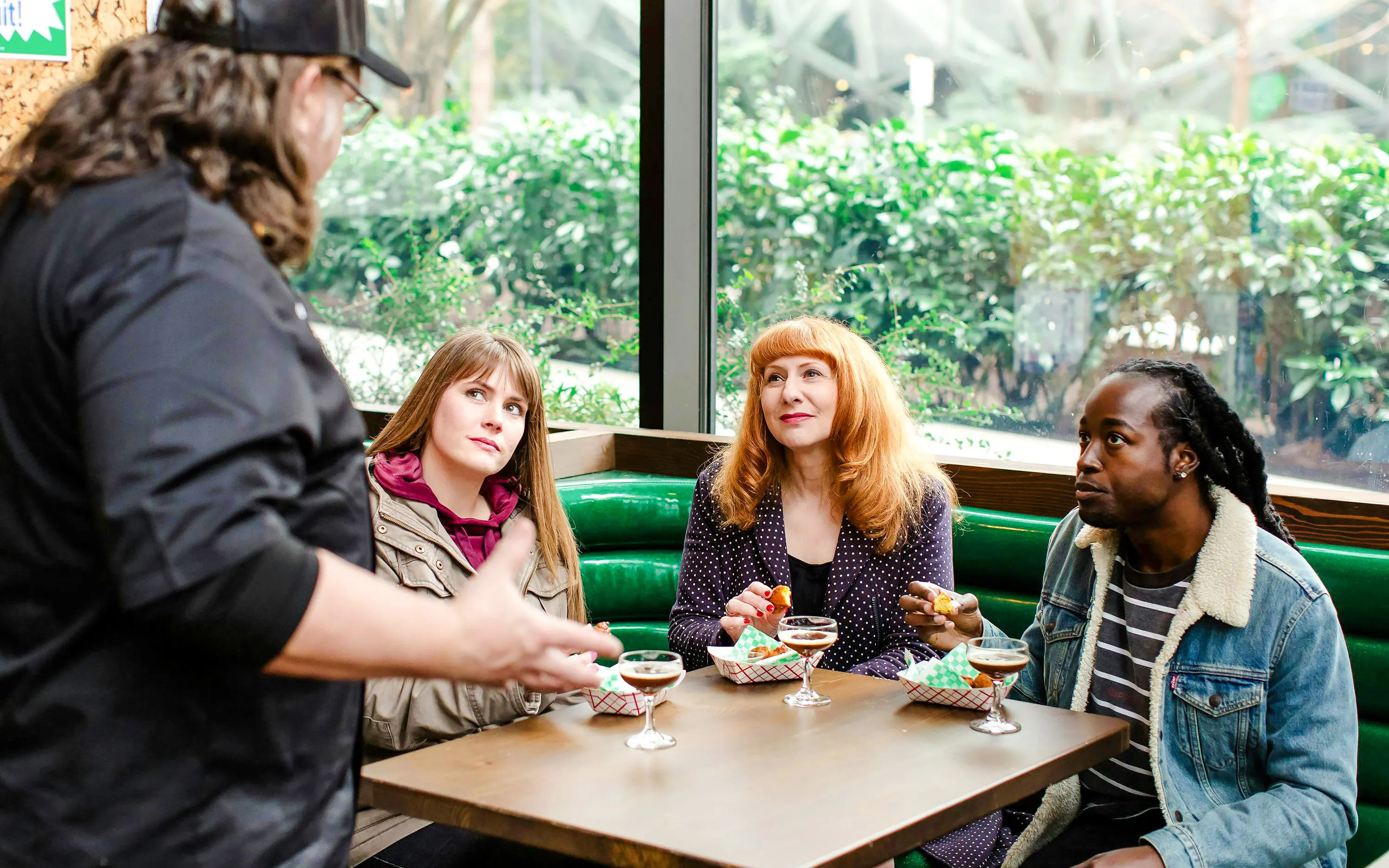 Group enjoying cocktails and snacks during Seattle Happy Hour Tour.