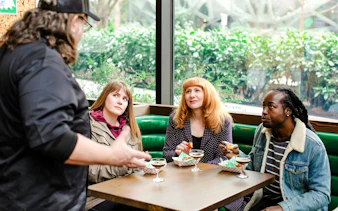Group enjoying cocktails and snacks during Seattle Happy Hour Tour.