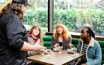 Group enjoying cocktails and snacks during Seattle Happy Hour Tour.