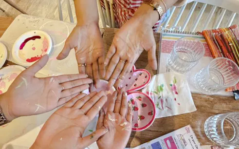 Hands with paint at a decorative painting workshop in Ourika, Marrakesh.