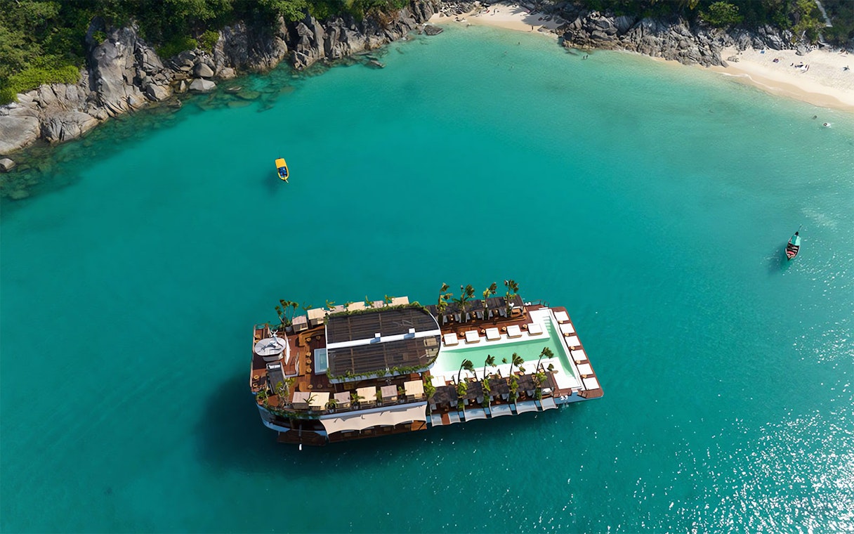 Aerial view of Yona Beach Club floating on turquoise waters, Phuket.