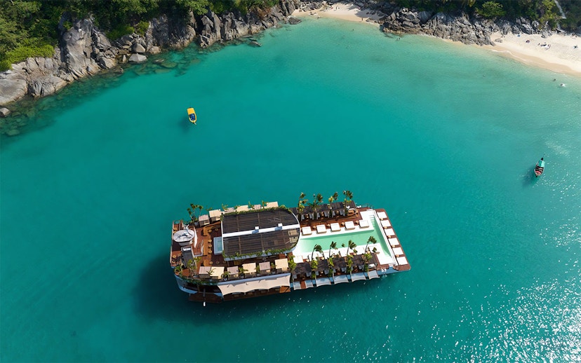 Aerial view of Yona Beach Club floating on turquoise waters, Phuket.