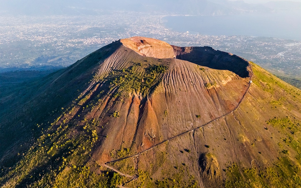 Mount Vesuvius crater with surrounding landscape, part of a Rome to Pompeii and Naples day trip.