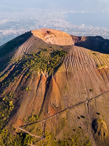 Mount Vesuvius crater with surrounding landscape, part of a Rome to Pompeii and Naples day trip.