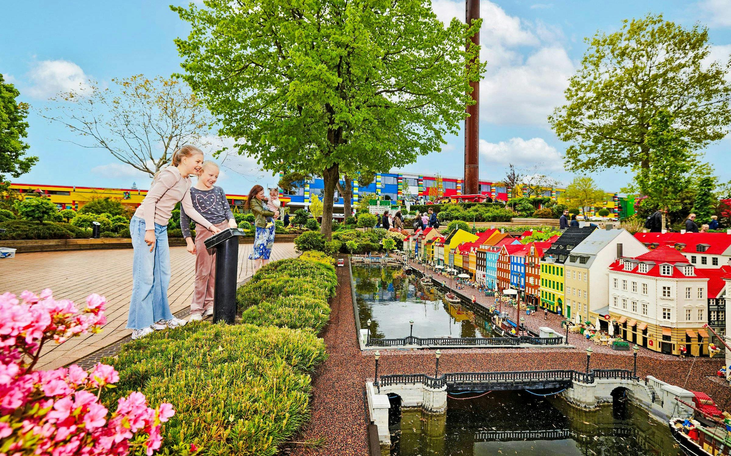 Children exploring LEGO miniature city at LEGOLAND® Billund.