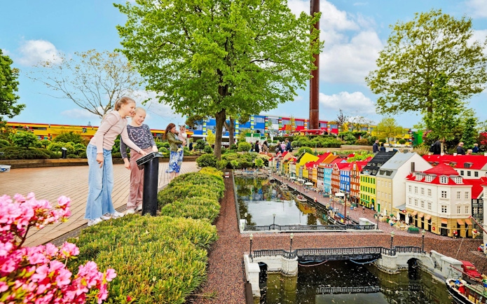 Children exploring LEGO miniature city at LEGOLAND® Billund.