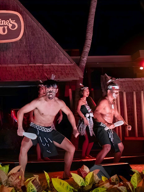 Traditional Polynesian play performed at Germaine's Luau with dancers in cultural attire.