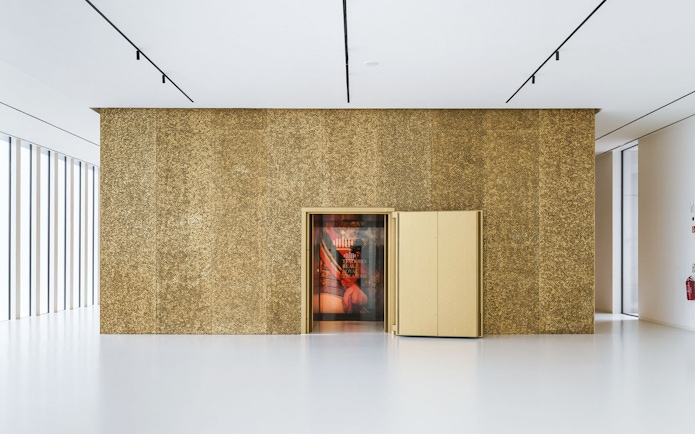 Entrance to Royal Treasure Museum with open golden door.