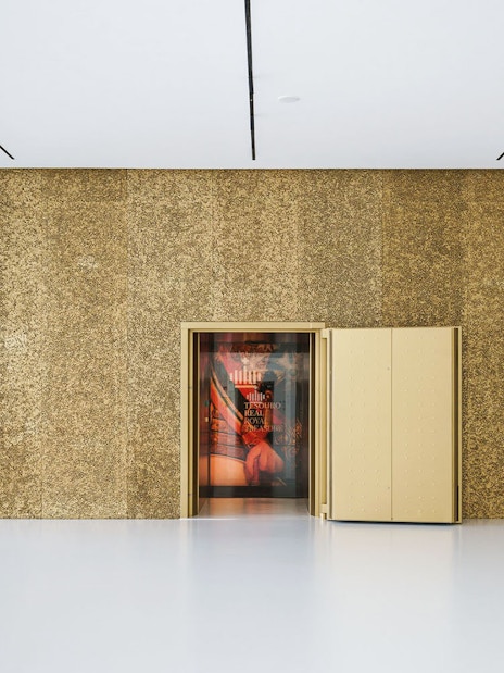 Entrance to Royal Treasure Museum with open golden door.