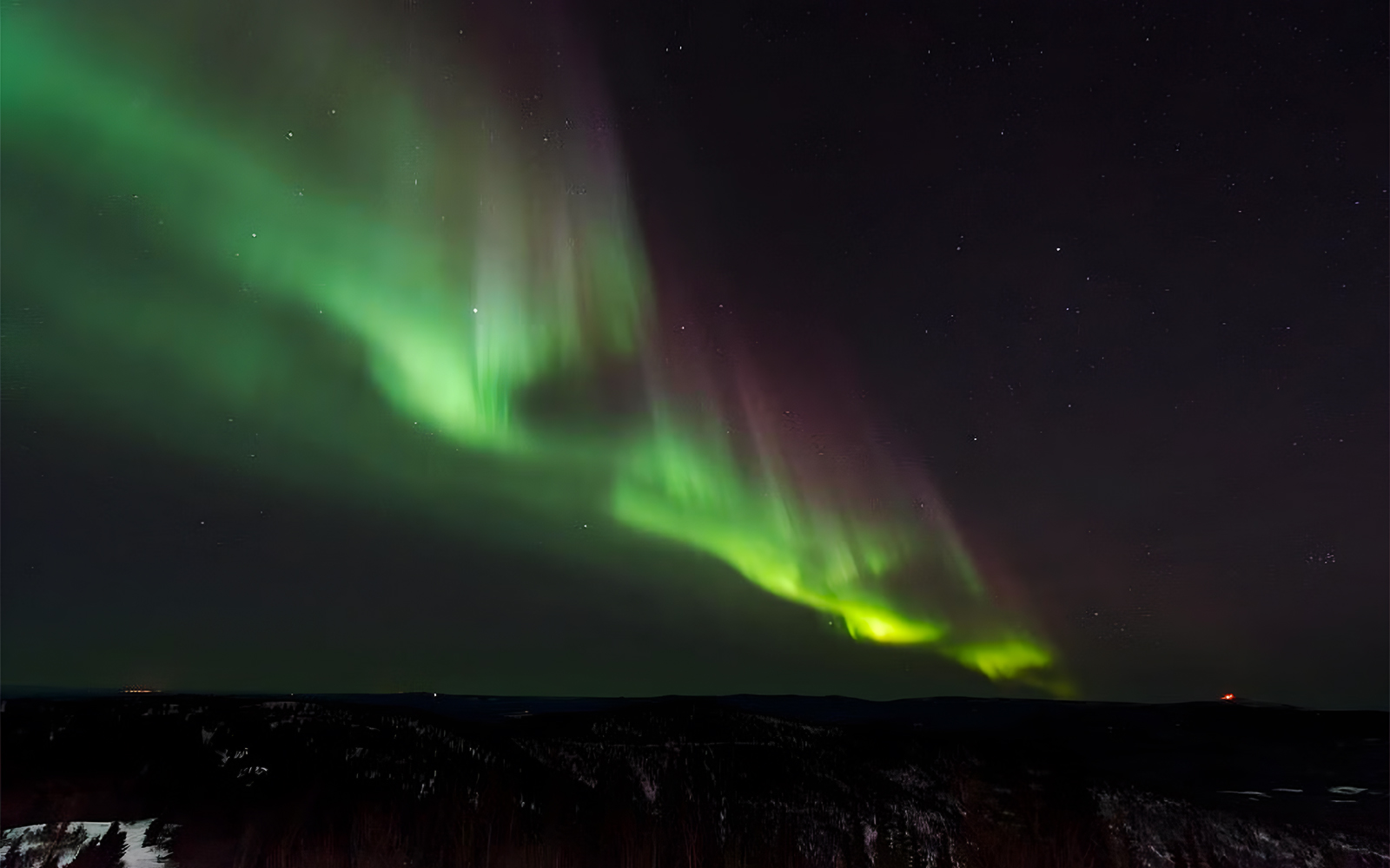 Northern Lights over Southern Iceland's lava fields and glaciers.