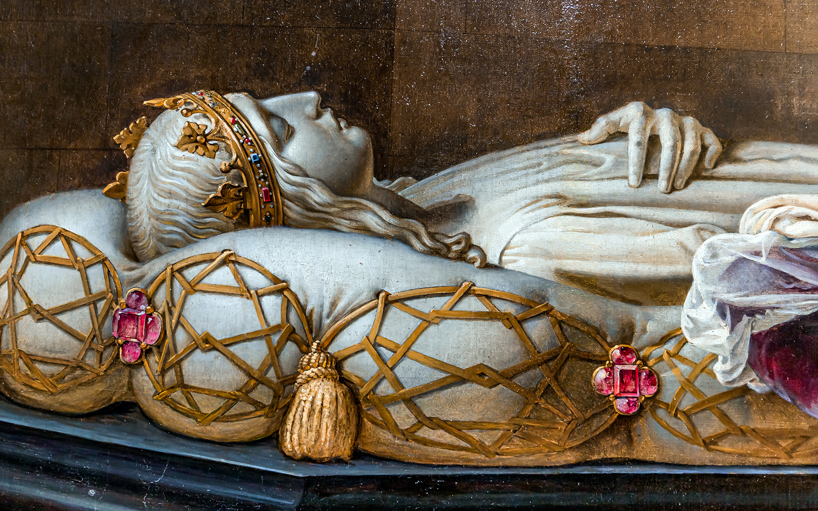 Royal tomb effigy at Blois Castle, France, showcasing intricate crown and pillow details.